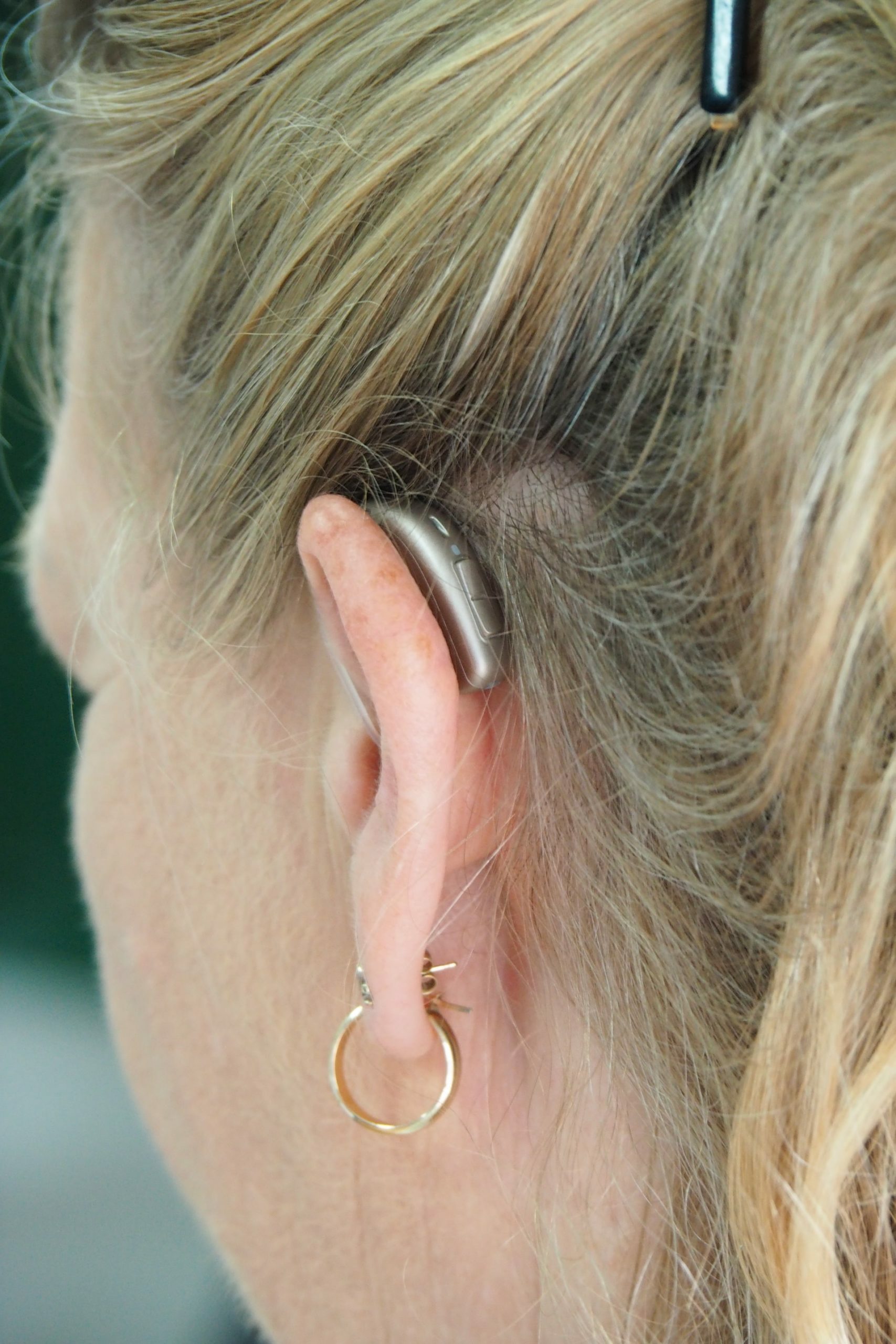 a man with a tattoo on his ear